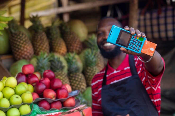 Market trader selling fruits and counting money